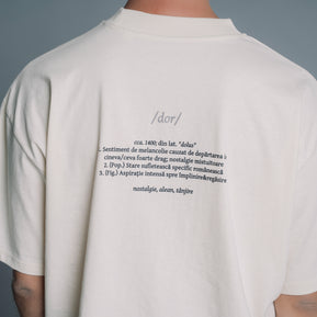 Person wearing a Natural RAW t-shirt with text on the back against a gray background